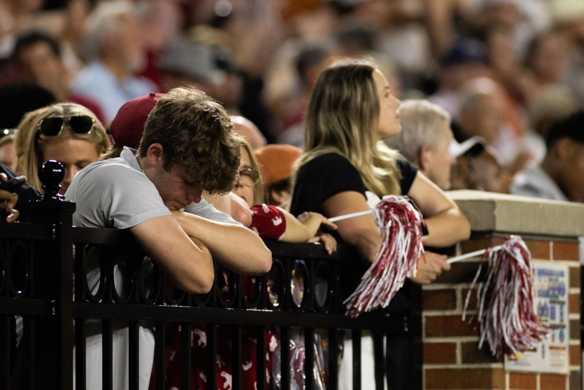 A young Alabama fan looks down at the turf at Bryant-Denny Stadium on September 9, 2023.