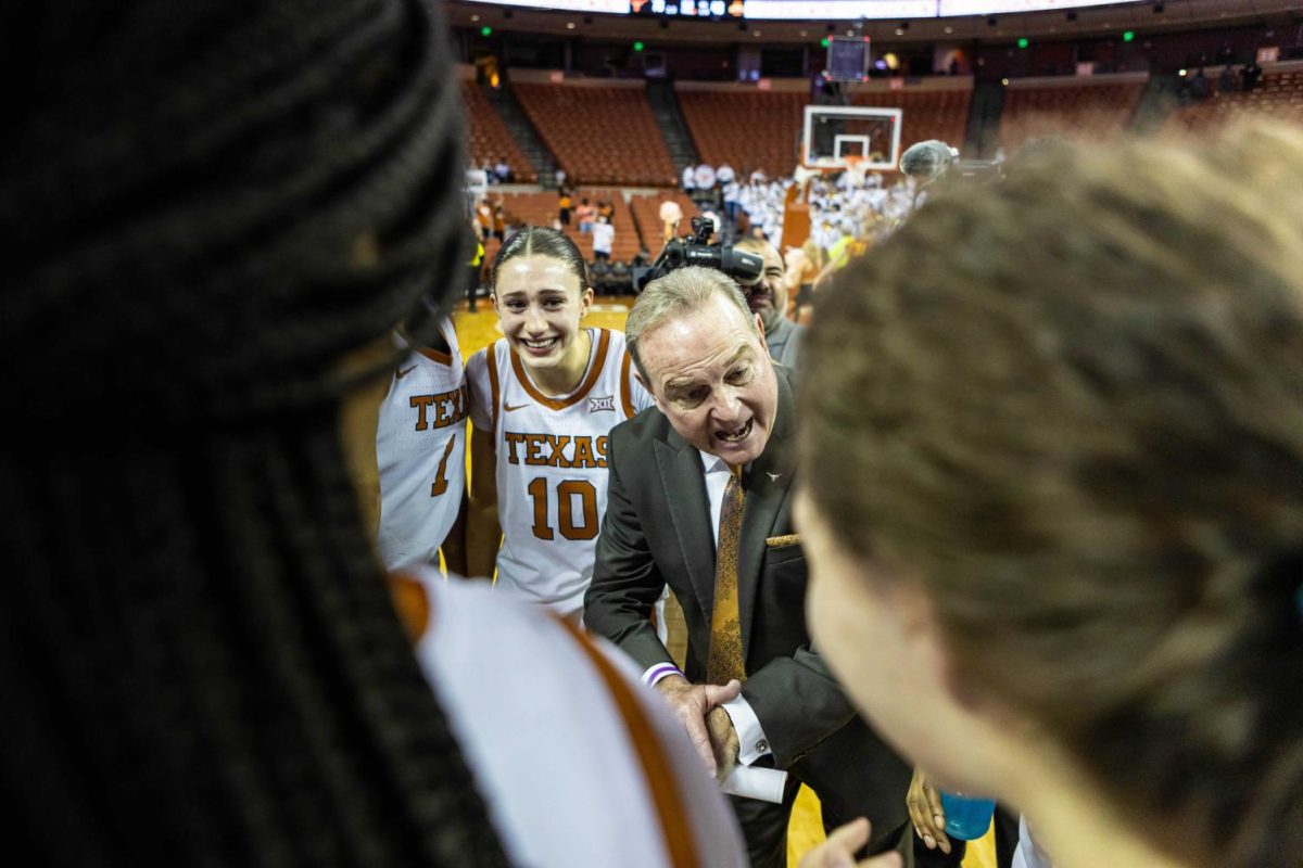 Vic Schaefer, Texas women’s basketball head coach, congratulates his players after a win. The Longhorns took down the Iowa State Cyclones 74-48 at the Frank Erwin Center on Feb. 16, 2022.