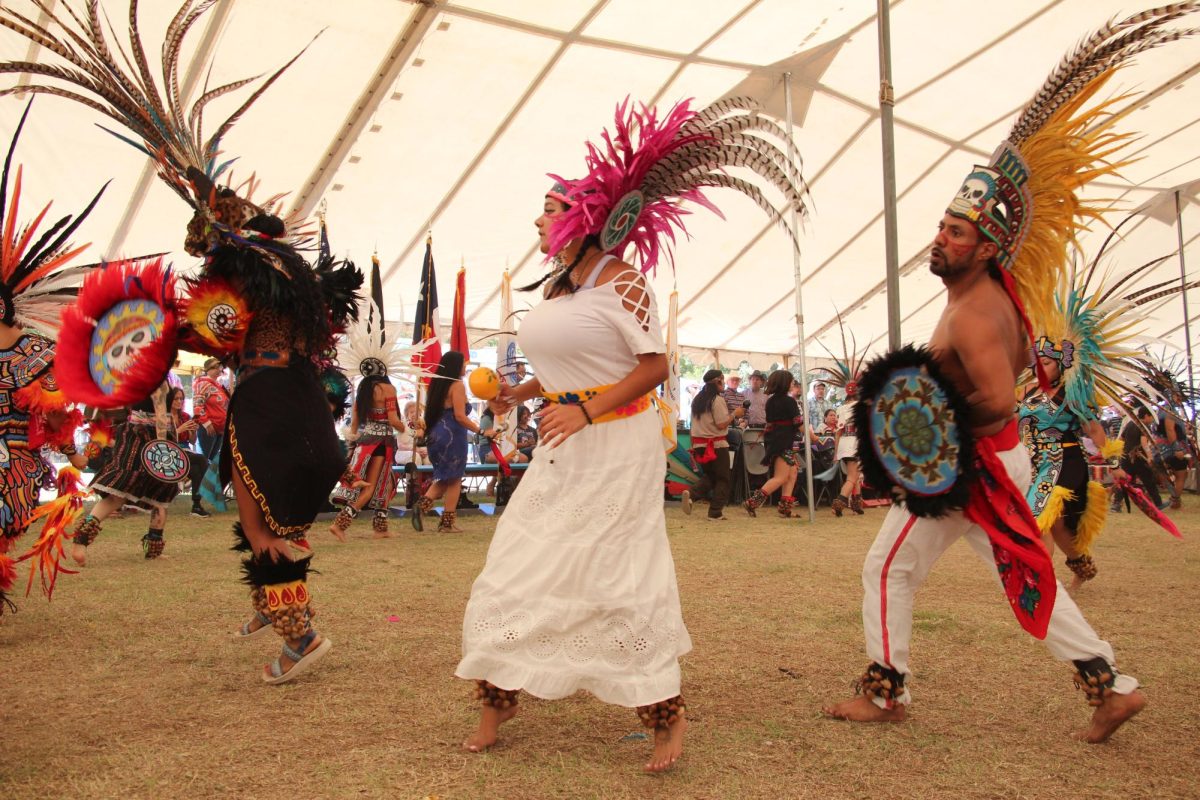 A group of indigenous performers begin their act at the Sacred Springs powwow in San Marcos, Texas on Oct. 8, 2023.