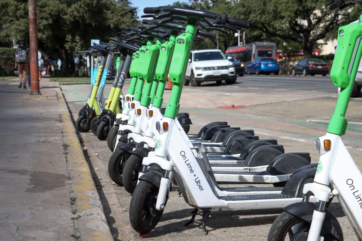 Electric scooters parked on The Drag on Oct. 4, 2023.