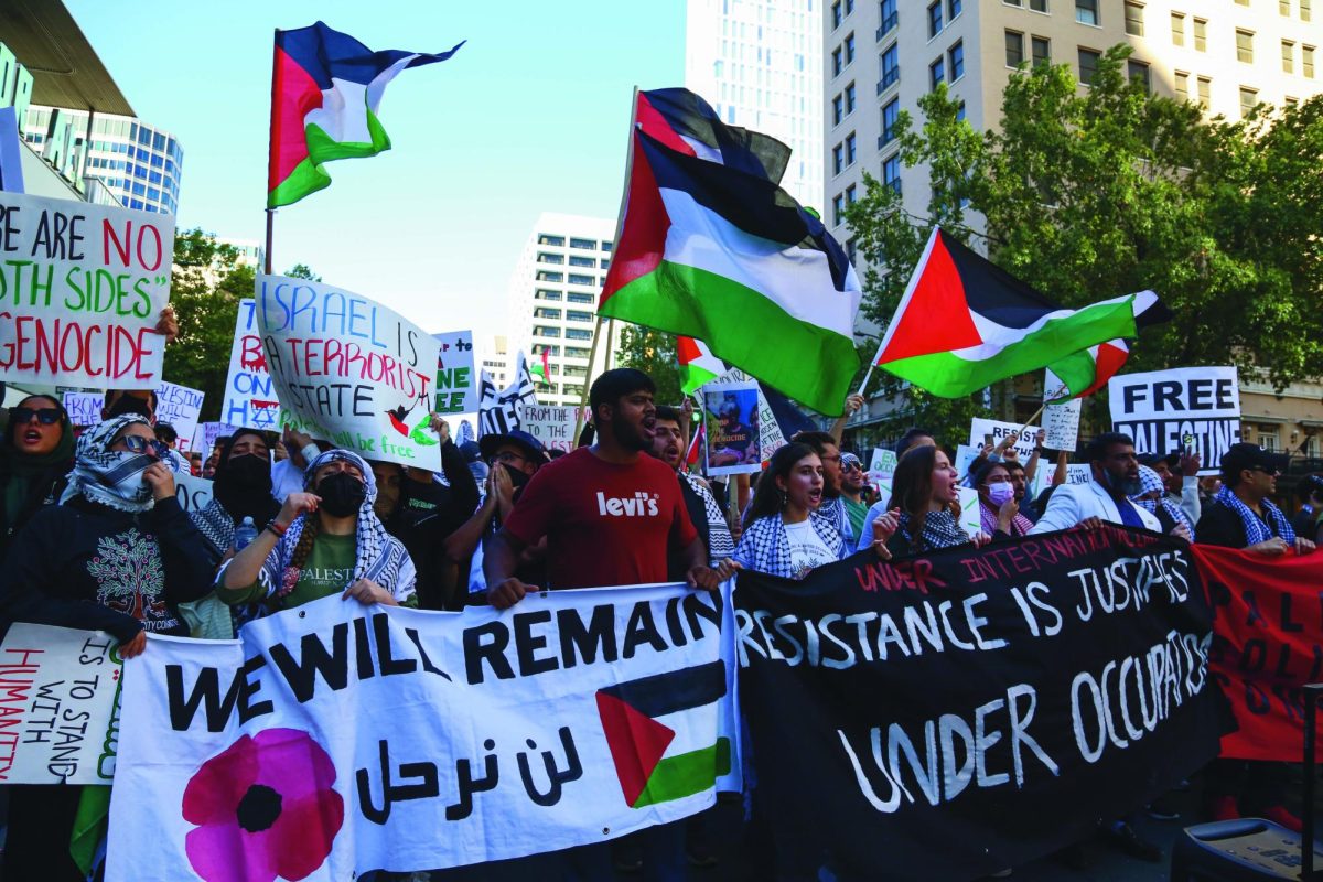 Protestors march through Downtown Austin to show support for Palestine on Oct. 15, 2023. The demonstration was organized by the Palestine Solidarity Committee, a UT student organization for Palestinian liberation and right of return.