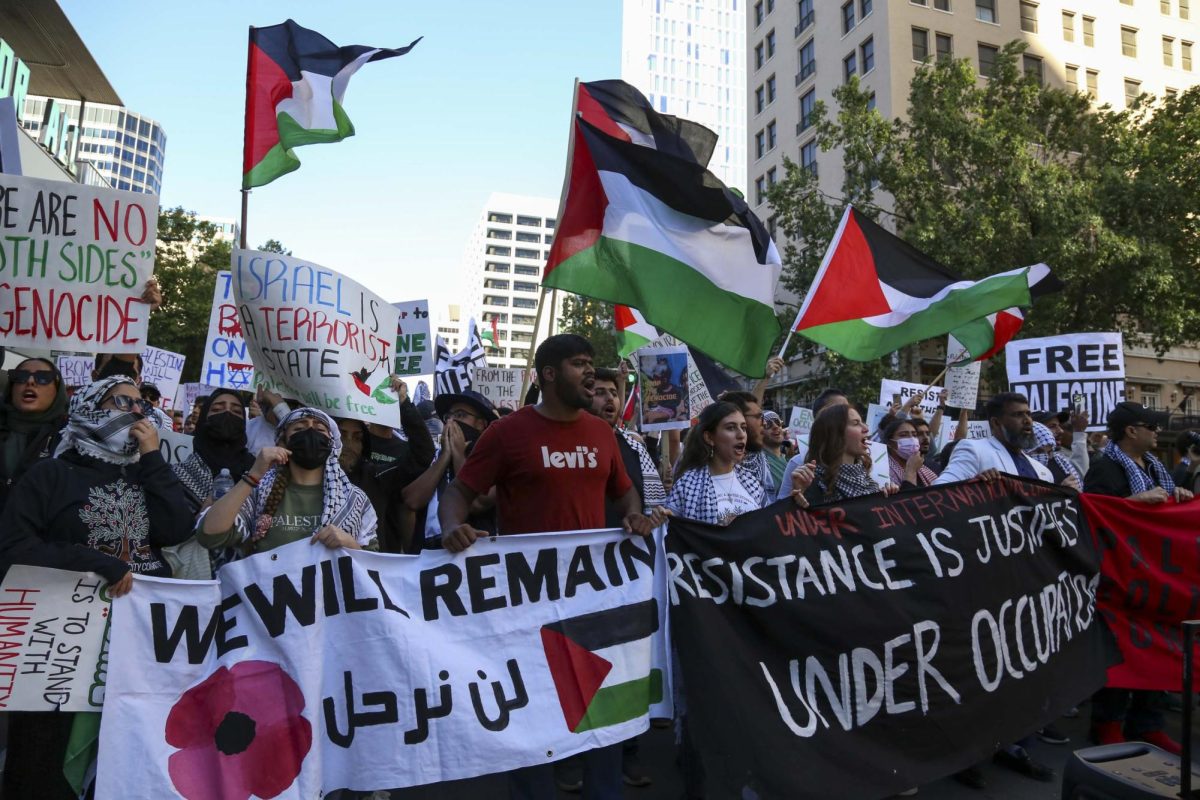 Protestors+march+through+Downtown+Austin+to+show+support+for+Palestine+on+Oct.+15%2C+2023.+The+demonstration+was+organized+by+the+Palestine+Solidarity+Committee%2C+a+UT+student+organization+for+Palestinian+liberation+and+right+of+return.