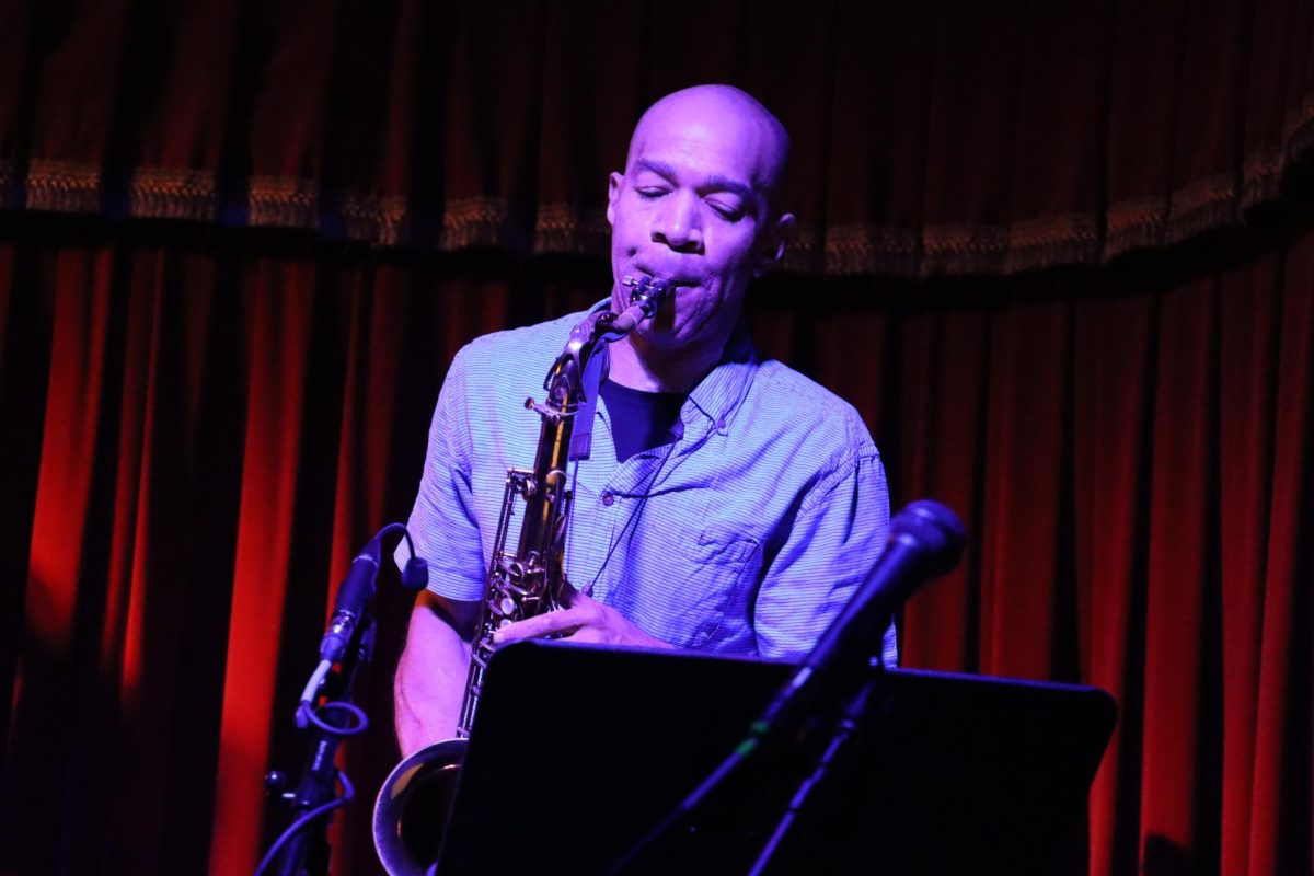 Michael Malone plays the saxophone in the Cactus Cafe on Oct. 15, 2023. Malone preformed as a part of the Cafe’s Jazz Night.
