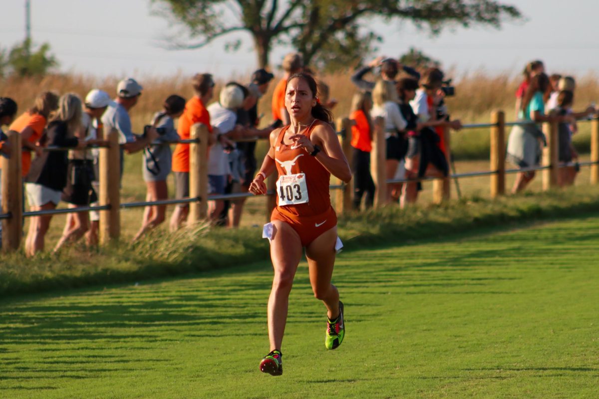 Graduate student Beth Ramos runs towards the finish line at the Cowboy Jamboree on Sep. 23, 2023. Ramos took 5th place with a time of 21:14, leading the Longhorns to place second as a team.