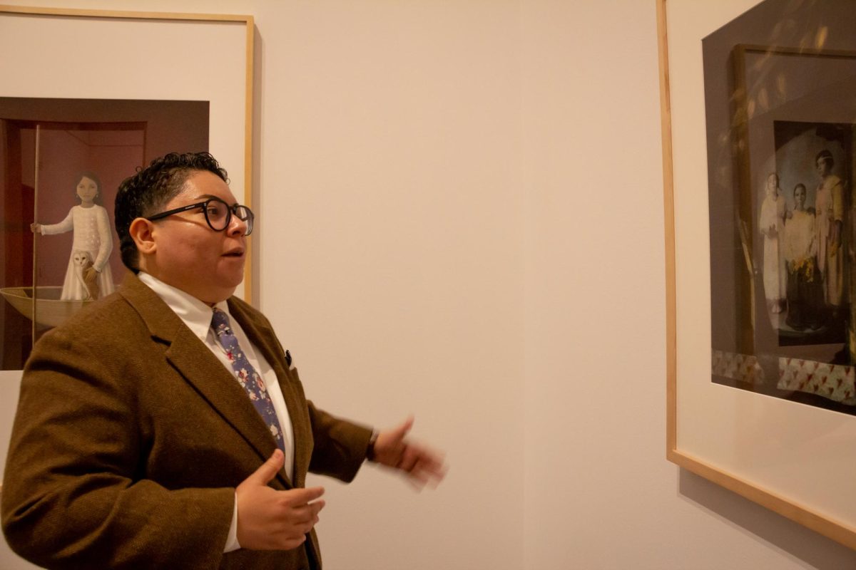 Associate Latino art curator Claudia Zapata describes the process behind a Latino photographers work at the Blanton Art Museum on Oct. 4, 2023.