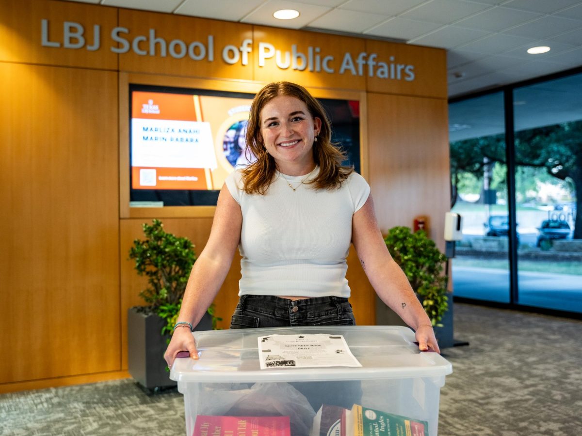 Gabby Douthitt, member of the LBJ Graduate Student Council, collects books for the Inside Books organization, a nonprofit that donates books and educational resources for people who are incarcerated, on Oct. 4, 2023.