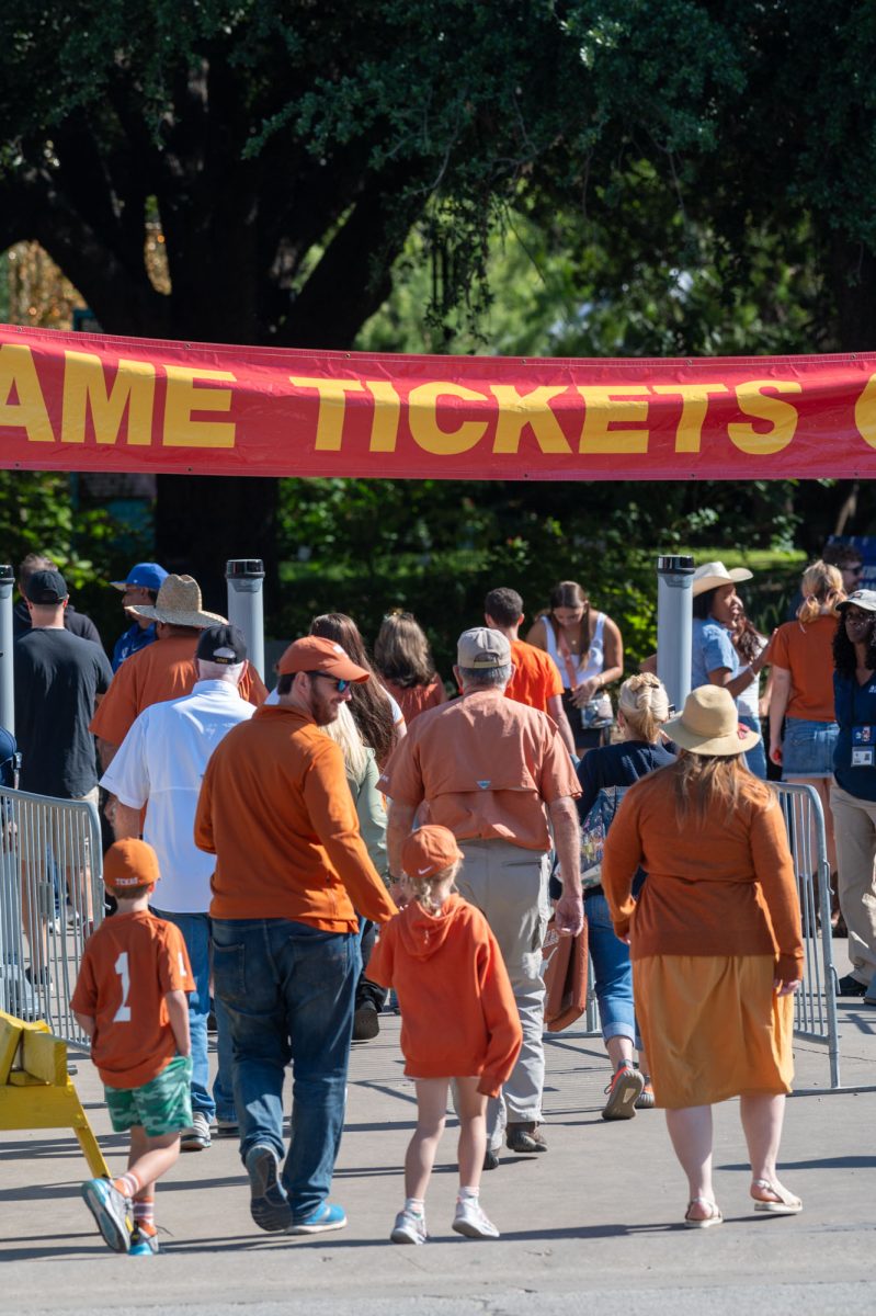 Ticket-holders enter the Cotton Bowl entrance at the Texas State Fair.