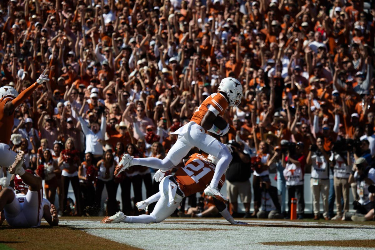 Defensive back Malik Muhammad recovers a blocked punt in the end zone and scores a touchdown during Texas game against Oklahoma on Oct 7, 2023.