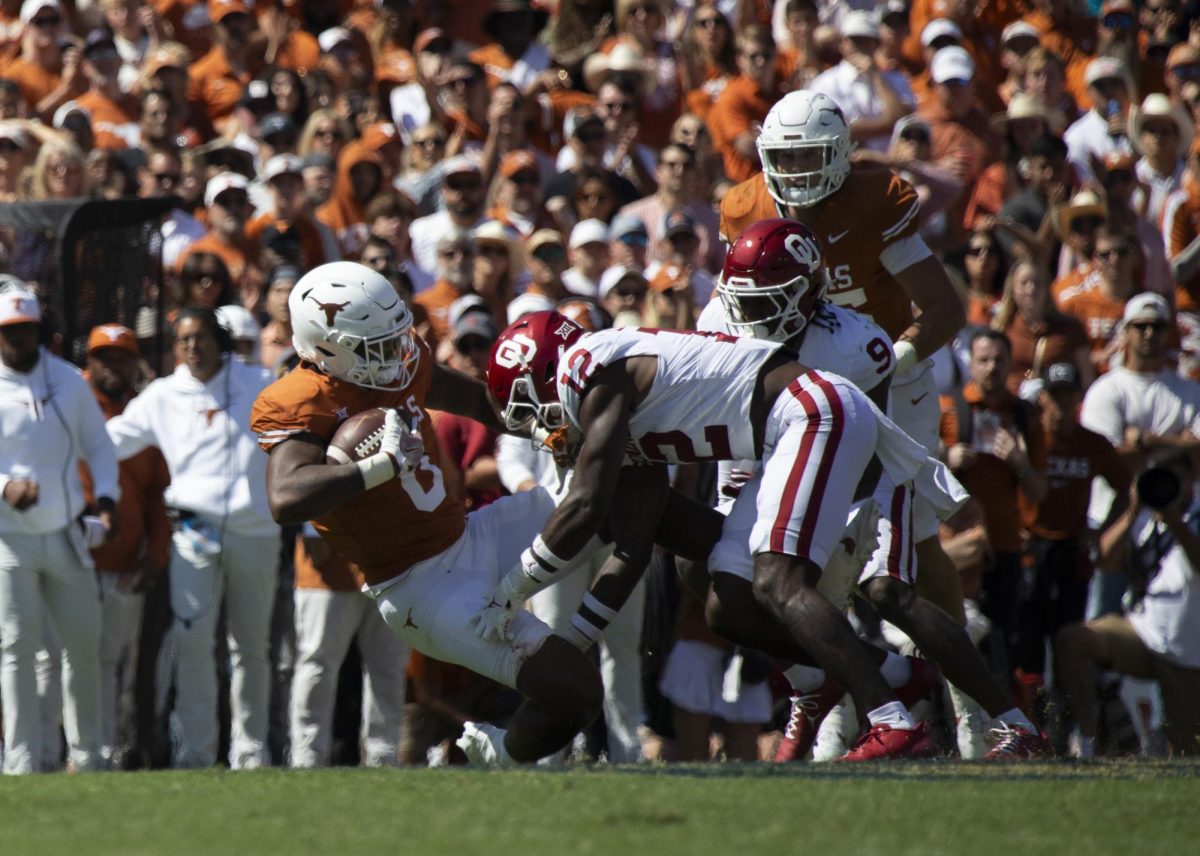 Tight+end+JaTavion+Sanders+is+tackled+during+Texas+game+against+Oklahoma+on+Oct.+7%2C+2023.+The+Longhorns+lost+to+the+Sooners+34-30+during+the+annual+Red+River+Rivalry+Game.+