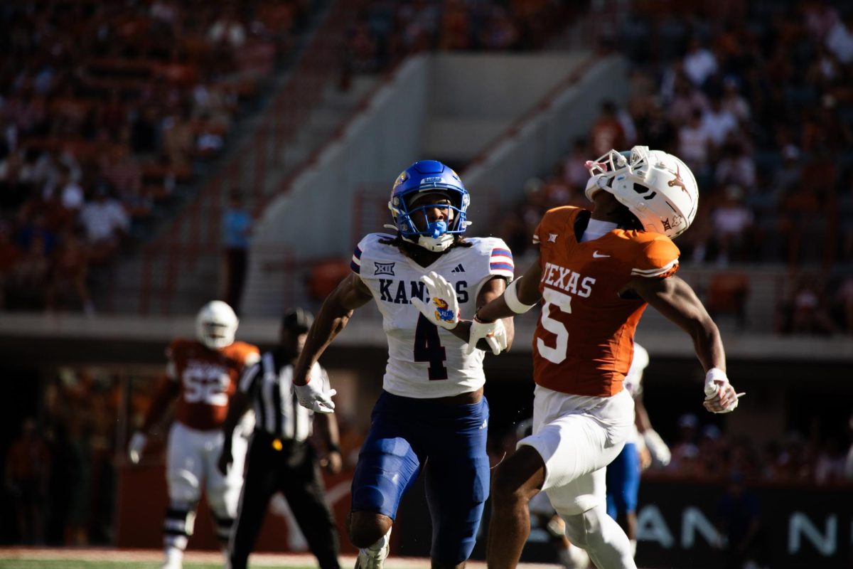 Junior wide receiver Adonai Mitchell looks to make a catch during Texas' game against Kansas on Sept. 30, 2023.