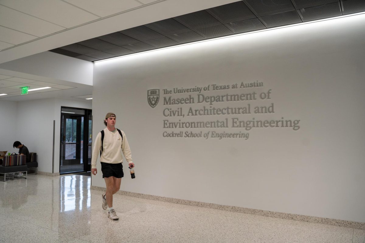 A person walks past the Maseeh sign in the Engineering Education and Research Center on Oct. 9, 2023.