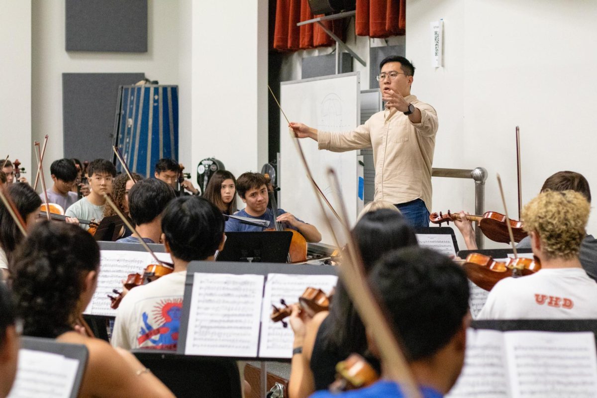The University Orchestra and their conductor practicing on September 26, 2023 in preparation for their upcoming recital.