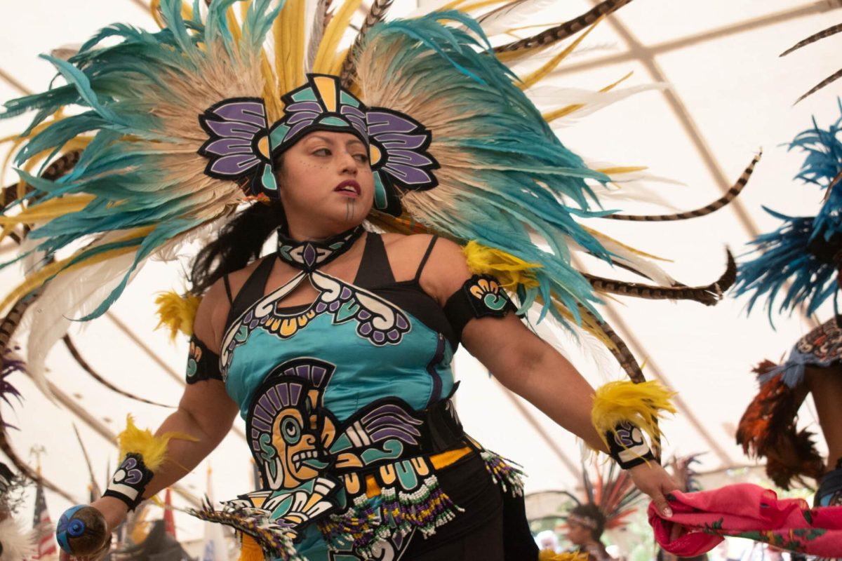 A performer dances to drums in the Danza Aztec Exhibition at the Sacred Springs Powwow in San Marcos on Oct. 8, 2023.