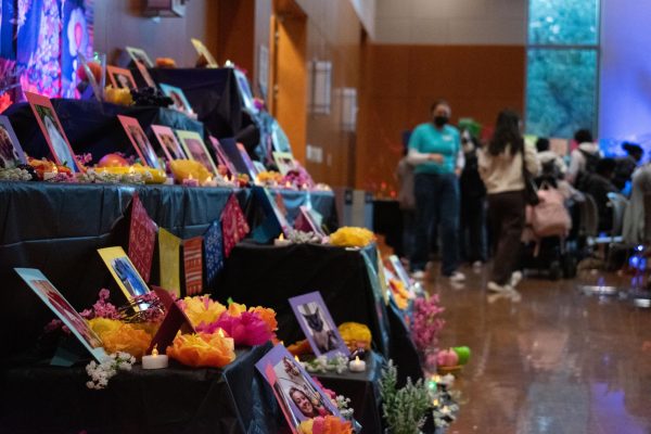 Students honor lost loved ones on the ofrenda at the Mexican American Culture Committee and Living the Longhorn Lifes Día de los Muertos event in the WCP Ballroom on Nov. 2, 2023.
