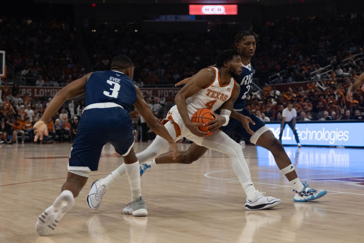 Junior guard Tyrese Hunter drives to the basket during the game against Rice on Nov. 15. Hunter was the leading scorer for the Longhorns with 18 points.