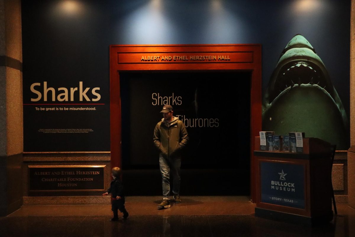 A father and son exit the Shark Exhibit at the Bullock Texas State History Museum on Nov. 26, 2023. This exhibit will be on view until Mar. 24, 2024.