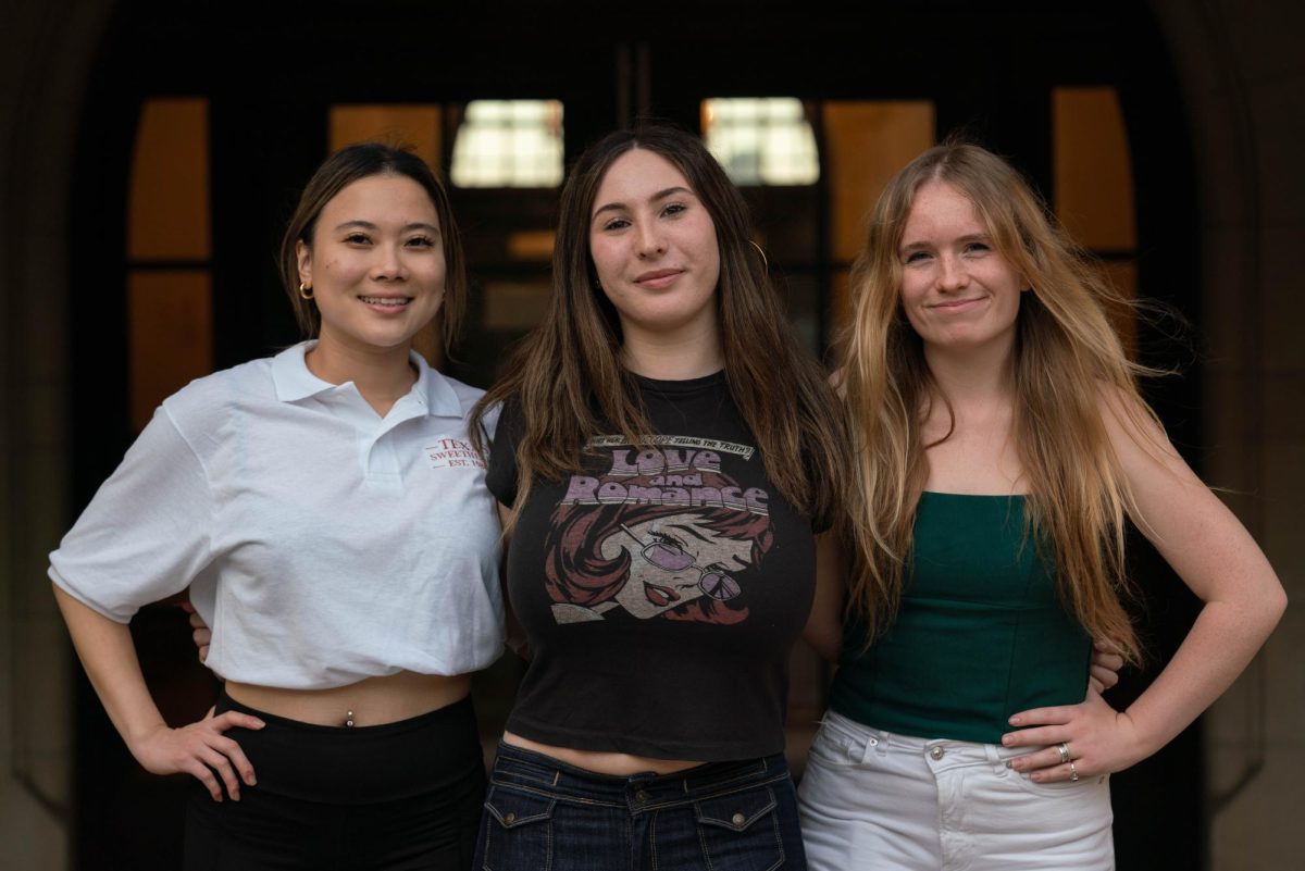 Senior civil engineering Cecilia Hwang, junior humanities Kayley Weiner and junior government Kirsten Corrigan stand in front of Mary Gearing Hall on Nov. 7. Hwang and Weiner are co-presidents of Girl Up, while  Corrigan is the public relations manager. 