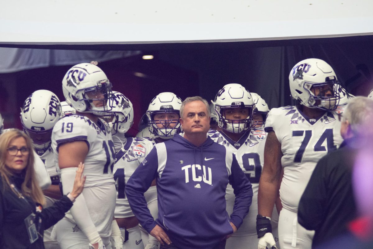 TCU head coach Sonny Dykes leads the team out of the tunnel before the Fiesta Bowl on Dec. 31, 2022.