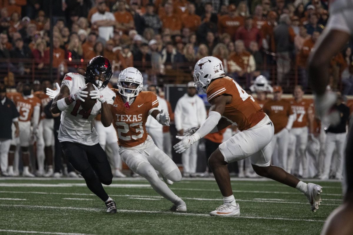Defensive back Jahdae Barron goes for a tackle during Texas game against Texas Tech on Nov. 24, 2023.