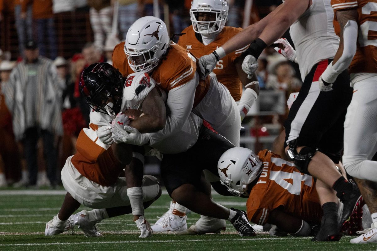 Defensieve lineman TVondre Sweat tackles a Texas Tech player during the game on Nov. 24. 