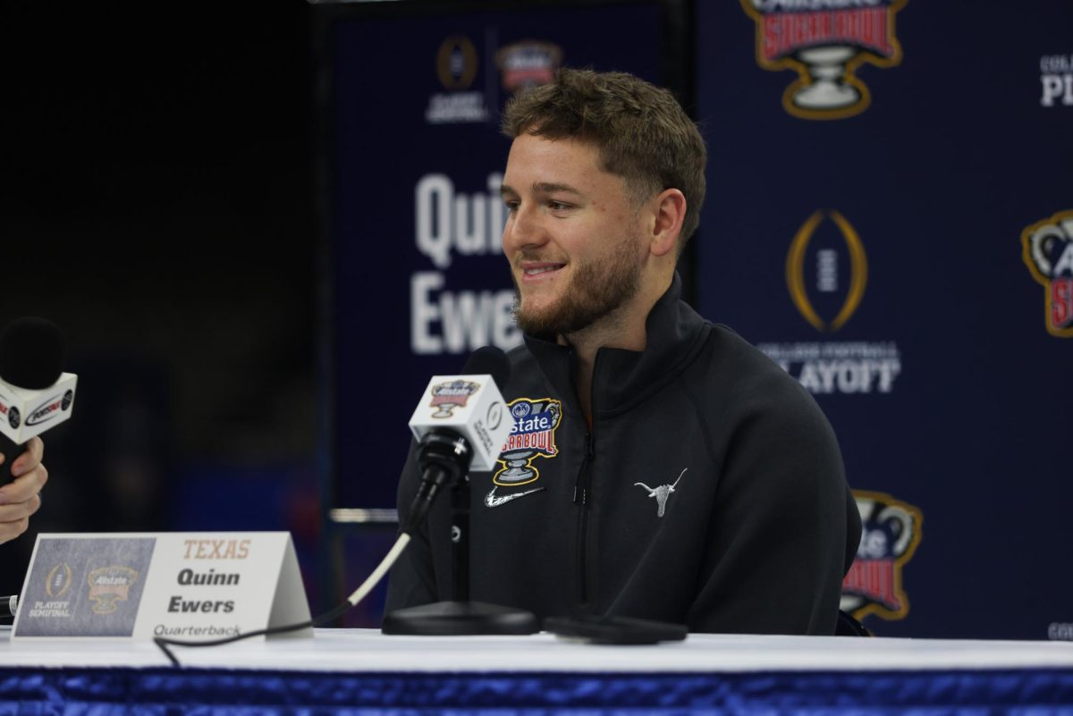 Quarterback Quinn Ewers speaks to the press during Texas’ media day on Dec. 30, 2023.