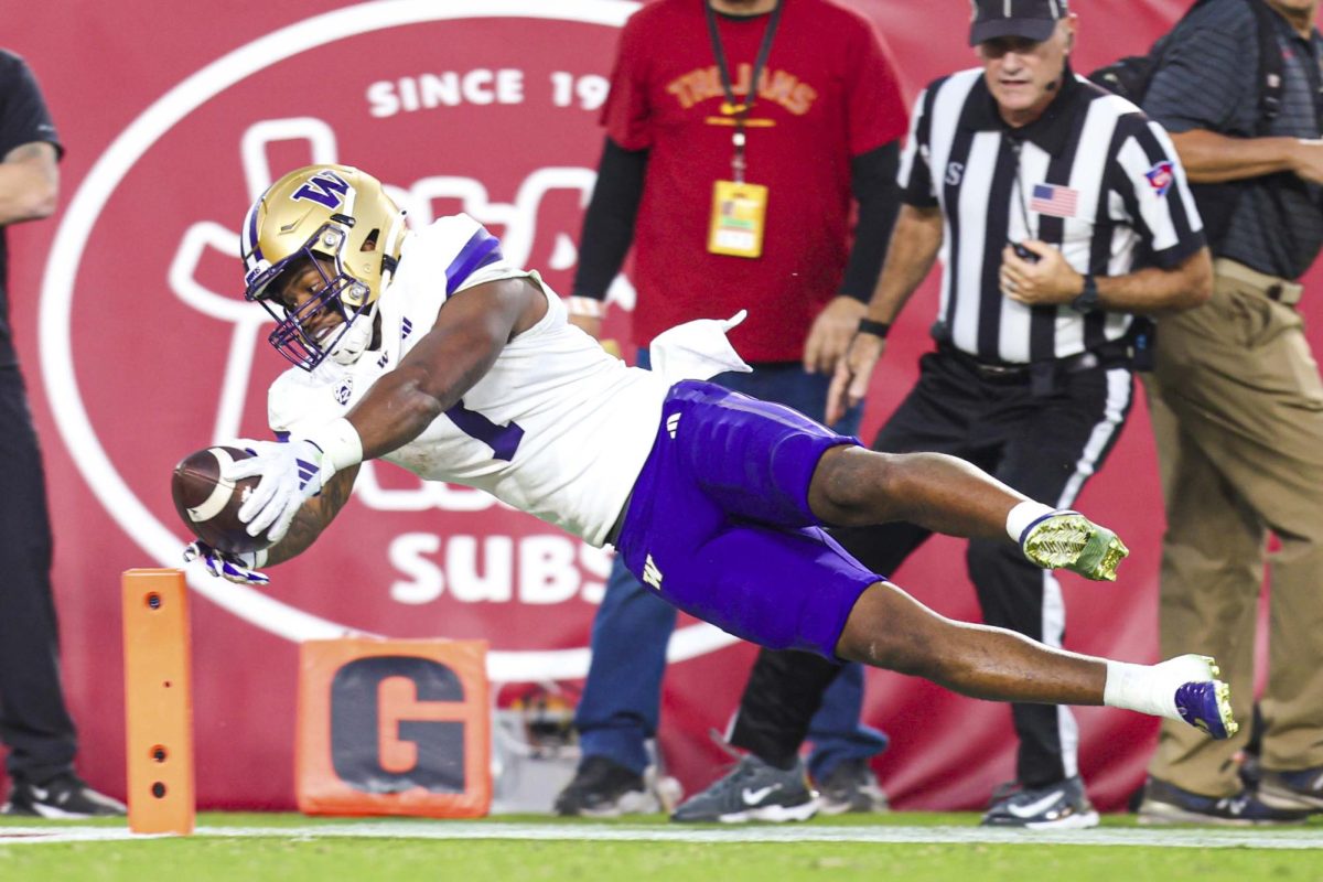 Washington Huskies running back Dillon Johnson dives for a touchdown during Washington's game versus the University of Southern California Saturday, November 4, 2023 at the Los Angeles Memorial Coliseum.