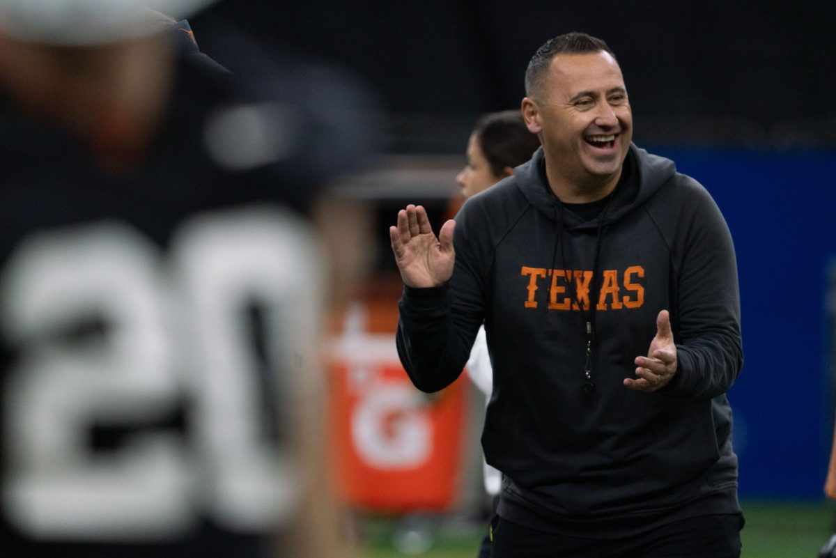 Coach Steve Sarkisian laughs with other members of the coaching staff during a practice on Dec. 30, 2023 for the Allstate Sugar Bowl. 