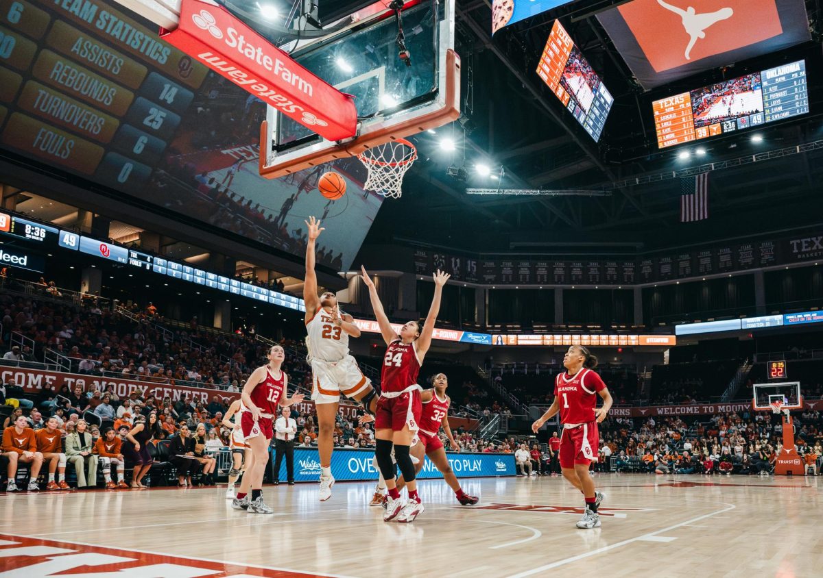 Texas forward Aaliyah Moore scores against the OU Sooners during the third quarter of their Basketball game at the Moody Center on Jan. 24, 2024. The Longhorns fell to the Sooners 91-87.