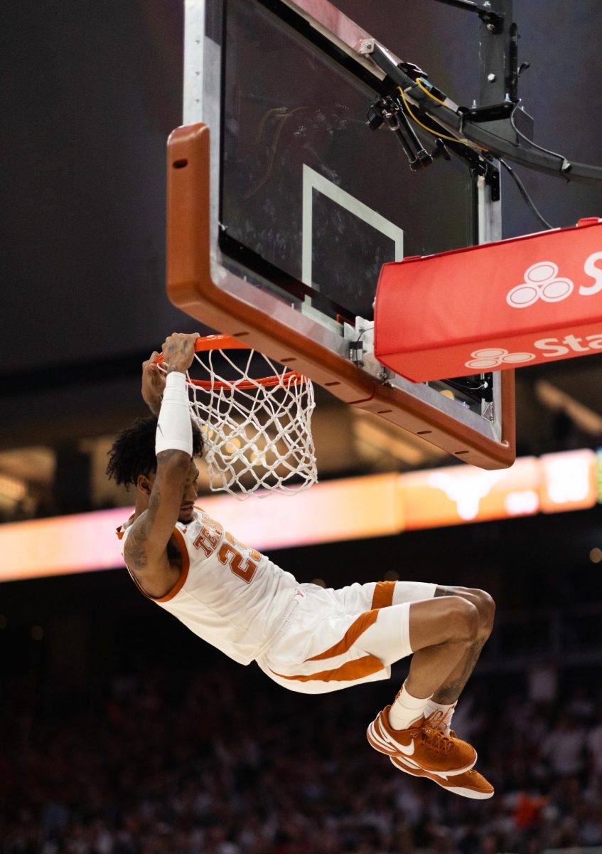 Dillon Mitchell dunks during Texas game against Houston on Feb. 1. 