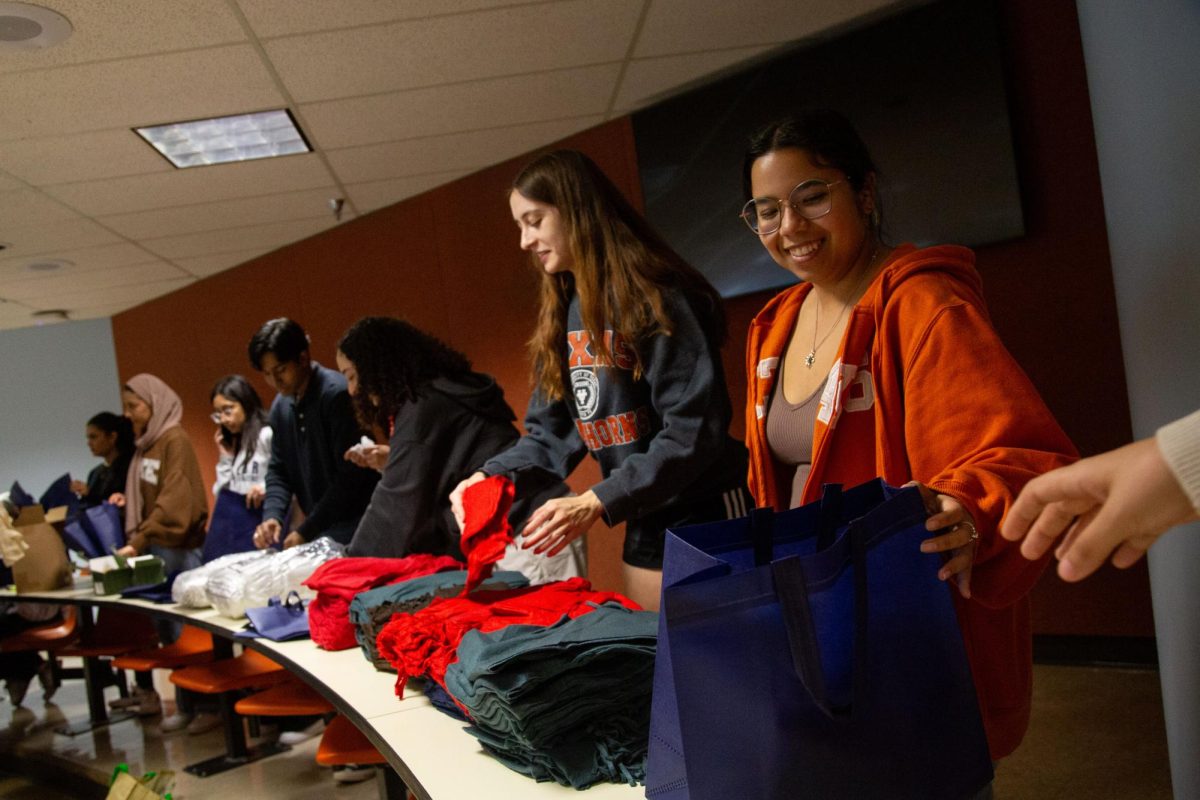 Students pack winter kits during UT United Mission Reliefs first Project Downtown event of the year on Feb. 7, 2024. Project Downtown is a monthly event where students package meals or care kits for underserved communities in Austin.