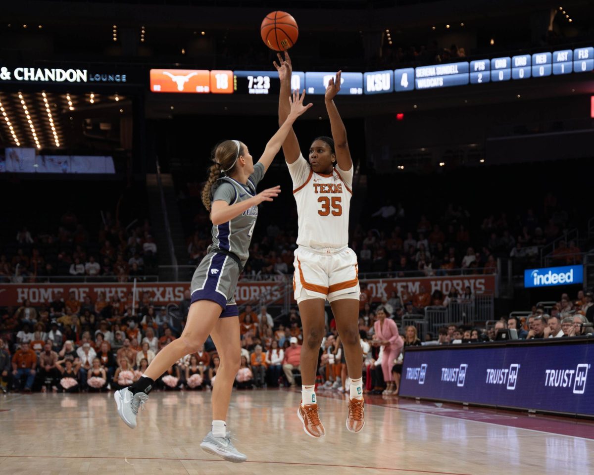 Forward Madison Booker tries for a three-pointer during Texas game against Kansas State on Feb. 4, 2024. 