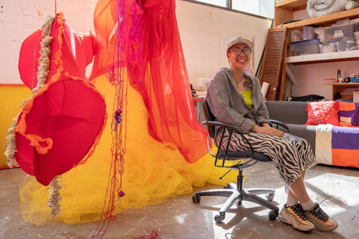 Masters of Fine Arts candidate in sculpture June Chau sits in his studio in the art building on Saturday, Feb. 24, 2024. June is one of many artists who opened their studios on Saturday during the MFA Open Studios and Silent Auction.