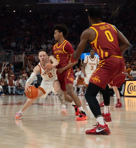 Guard Chendall Weaver dribbles towards the basket during Texas game against Iowa State on Feb 6, 2024. 