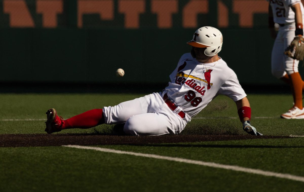 St. Louis Cardinal Mike Antico slides to second during the Texas Baseball Alumni Game on Saturday. Antico played for Texas in 2021.