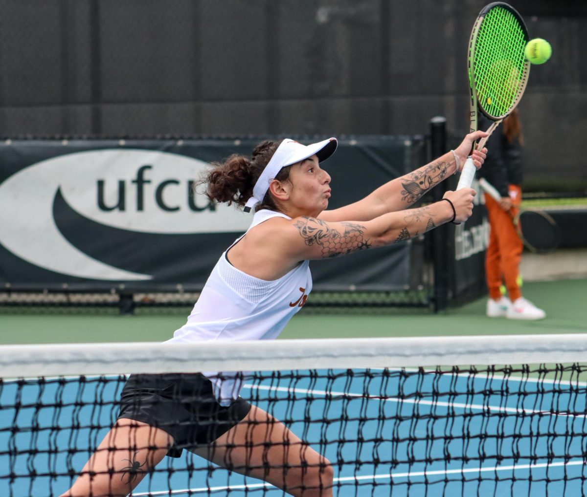 Redshirt sophomore Vivian Ovrootsky lunges to return the ball on Jan. 26, 2024. In singles play, Ovrootsky was leading 6-4 against Danielle Tuhten of Baylor University when play stopped as the Longhorns clinched the win.