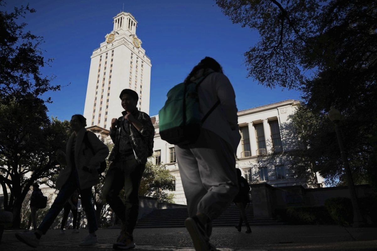 Students walking past the UT Tower on Dec. 2, 2021.