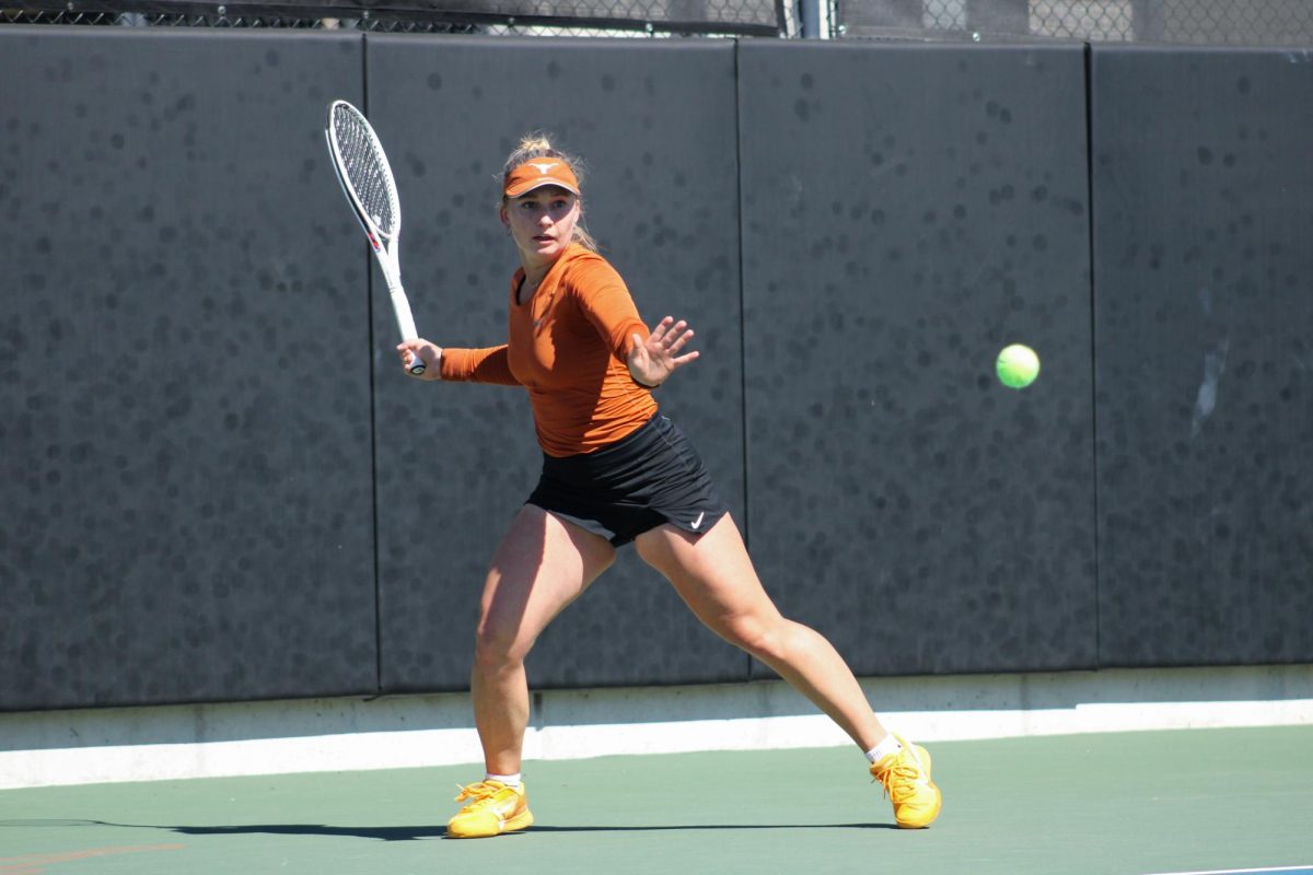 Graduate student Tanya Sasnouskaya prepares to hit the ball during singles play against Ariana Arseneault of Auburn University on February 18, 2024. Her match was tied when play stopped as the Longhorns clinched the win.