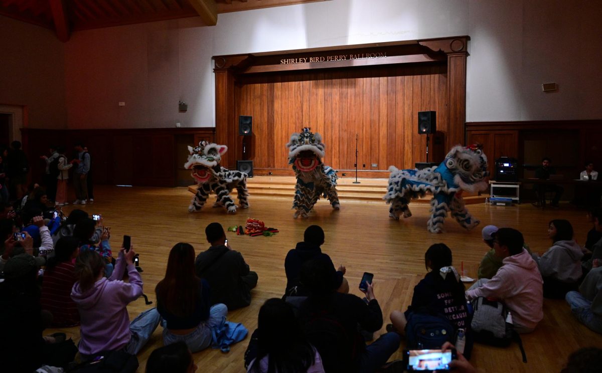 Members of the Heavenly Dragon Lion Dance Association perform a traditional Chinese Dragon Dance at the Shirley Bird Perry Ballroom in the Texas Union on Tuesday. Daniel Nguyen, Wesley Vu Tran, Maya Goodman, Greyson Baker, Anthony Pham and Aria Guat performed the dance, while Kevin Gian, James Dam, Tia Truong and Kelly Phan played the musical accompaniment.