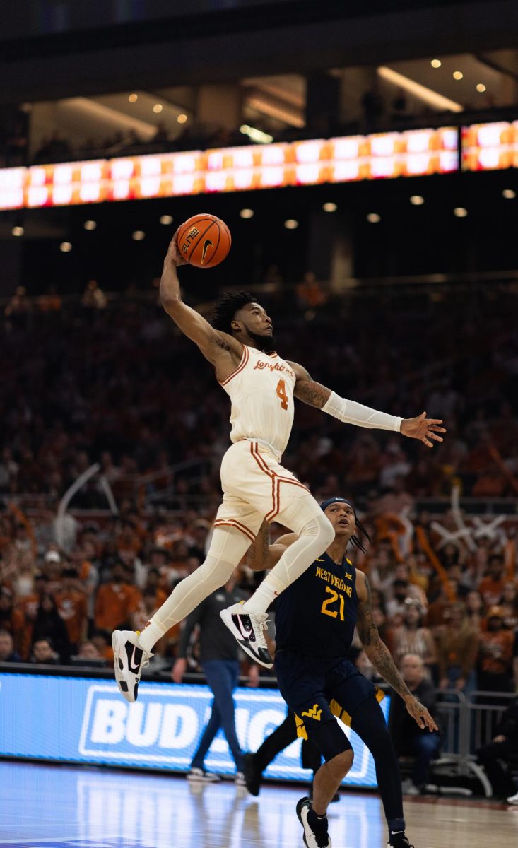 Tyrese Hunter attempts to score during Texas game against West Virginia on Feb. 10, 2024.