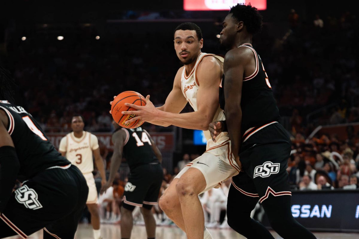 Forward+Dylan+Disu+drives+to+the+basket+during+Texas+game+against+Oklahoma+State+on+March+2%2C+2024.+The+Longhorns+won+the+game+81-65.+