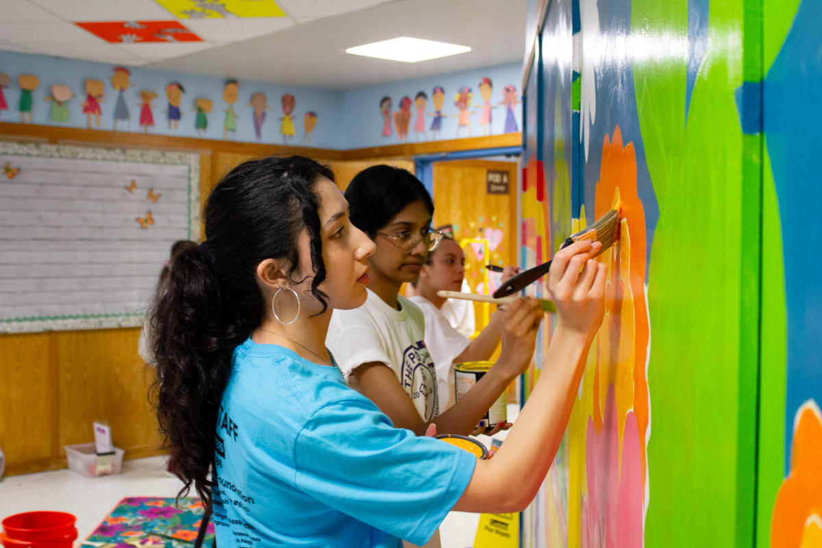 Volunteers+from+The+University+of+Texas+help+paint+a+mural+designed+by+Christina+Ciaburri+at+Wid%C3%A8n+Elementary+School+on+March+2%2C+2024.