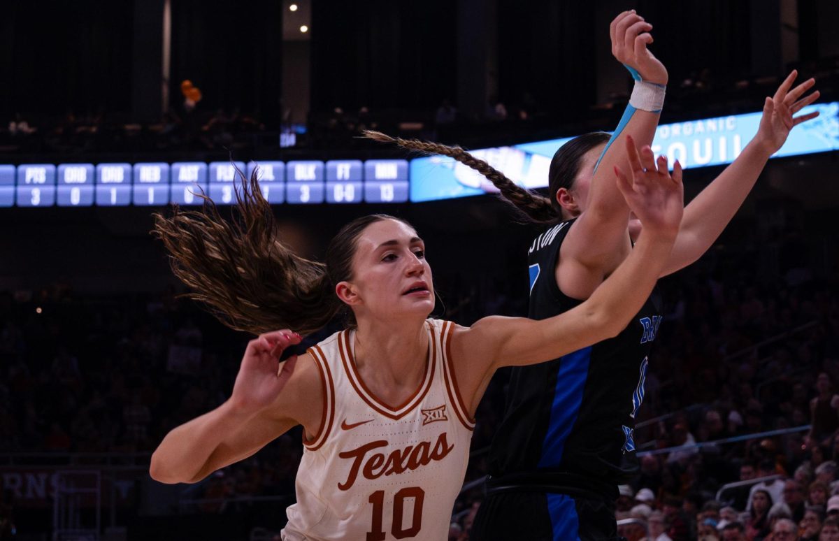Texas Guard Shay Holle defends against BYU Guard Kailey Woolston in the game on Saturday at Moody Center. The Longhorns defeated the Cougars 71-46, ending their season before the Big 12 Championshiop.