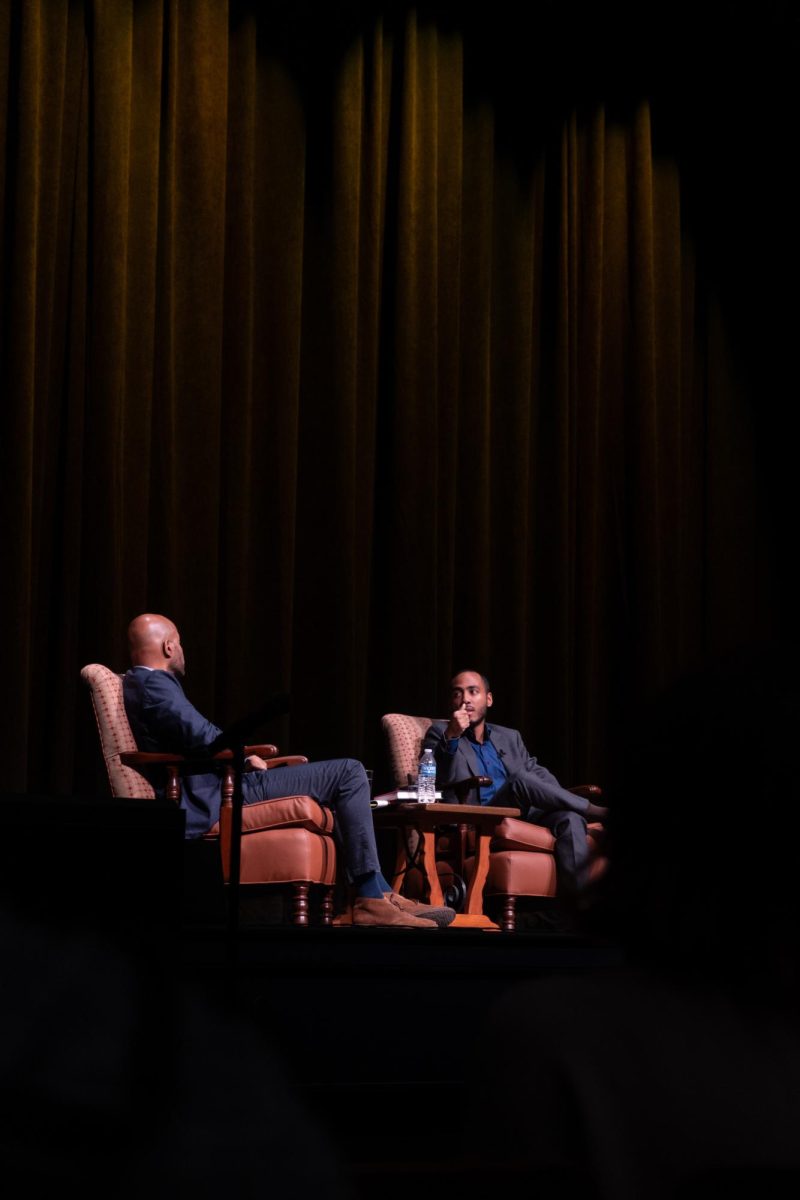 Peniel Joseph (left) debates Coleman Hughes on race politics in the United States as a part of the Civil Discord Symposium at Hogg Memorial Auditorium in Austin, Texas on March 21, 2024.