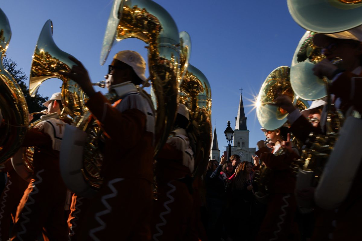 The Longhorn Band marches down Decatur St. in New Orleans on Dec. 31, 2023.		
