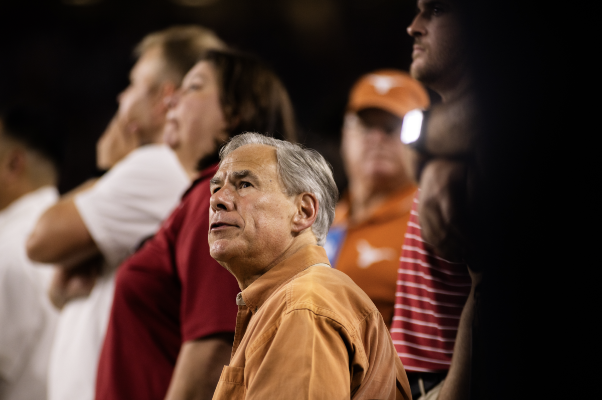 Texas Governor Greg Abbott watches the Longhorns game against Alabama from the sidelines on September 9, 2023 at Bryant-Denny Stadium.
