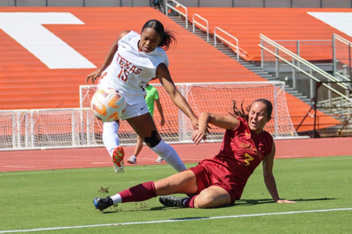 Junior forward Trinity Byars jumps as she kicks the ball away from an opponent on October 8, 2023. Byars played 90 minutes in this matchup against Iowa State and had one assist to contribute to the Longhorns 2-1 victory over the Cyclones. 