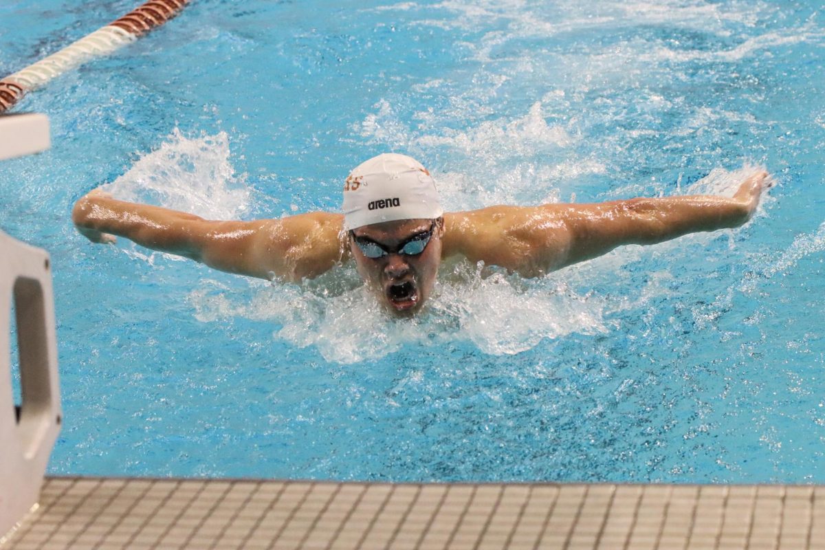 A+Texas+swimmer+competes+in+the+200m+butterfly+on+Feb.+2%2C+2024+at+a+meet+against+TCU.
