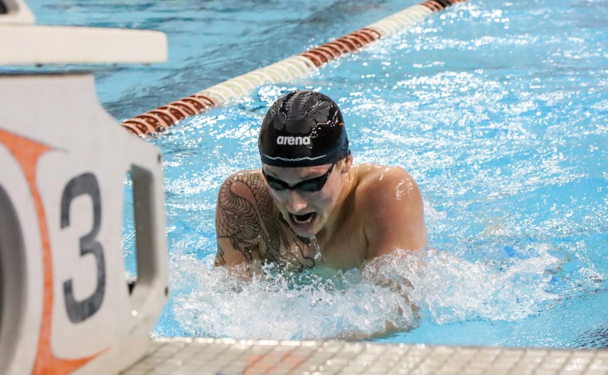 Sophomore Alex Enyeart takes a breath during the 400 meter individual medley on Feb. 2, 2024. Enyeart placed first in this event as well as in the 400 meter freestyle, with times of 4:31.64 and 3:59.74, respectively.