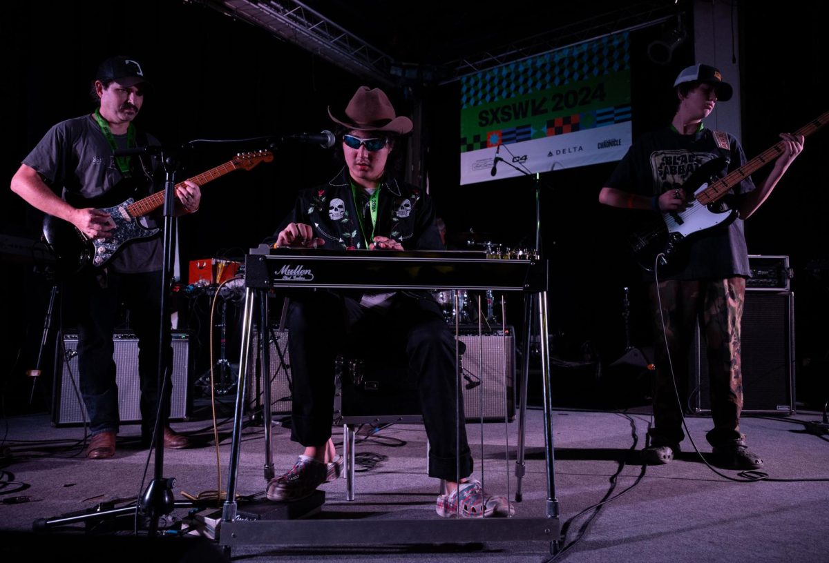 Noah Faulkner, also known as Pedal Steel Noah, opens for the SXSW Music Opening Party on March 12, 2024. He performs with his father Jay Faulkner (left) and his brother Nate Faulkner (right).