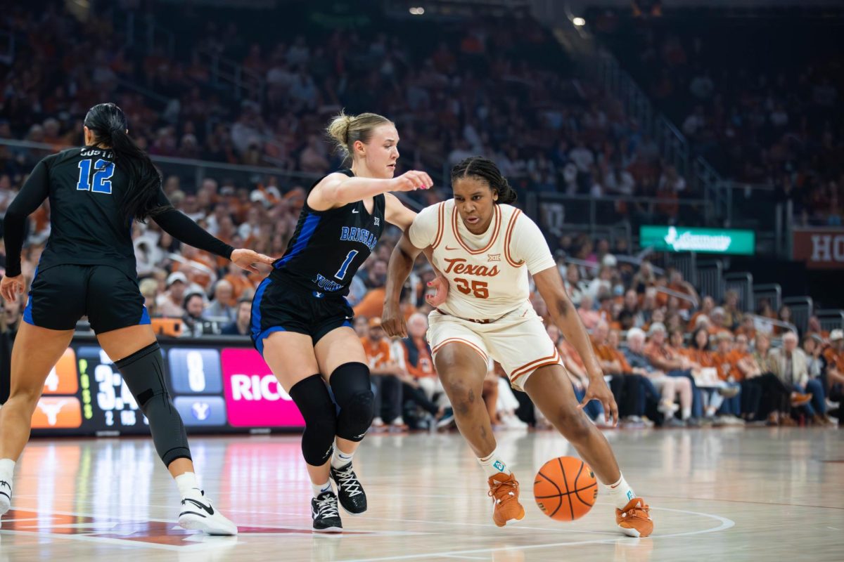Freshman guard Madison Booker drives to the basket during Texas game against BYU on March 2, 2024. Booker led the scoreboard for the Longhorns with 20 points. 